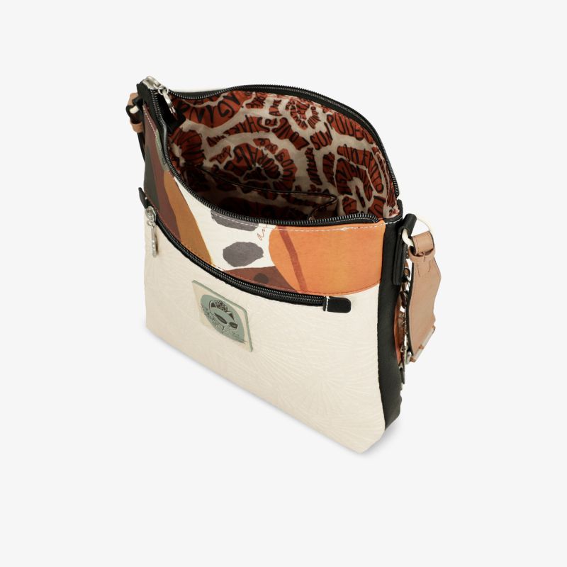 Modische Handtasche mit offenem Reißverschluss, sichtbarem Innenfutter und eleganter Farbkombination schräg vorne