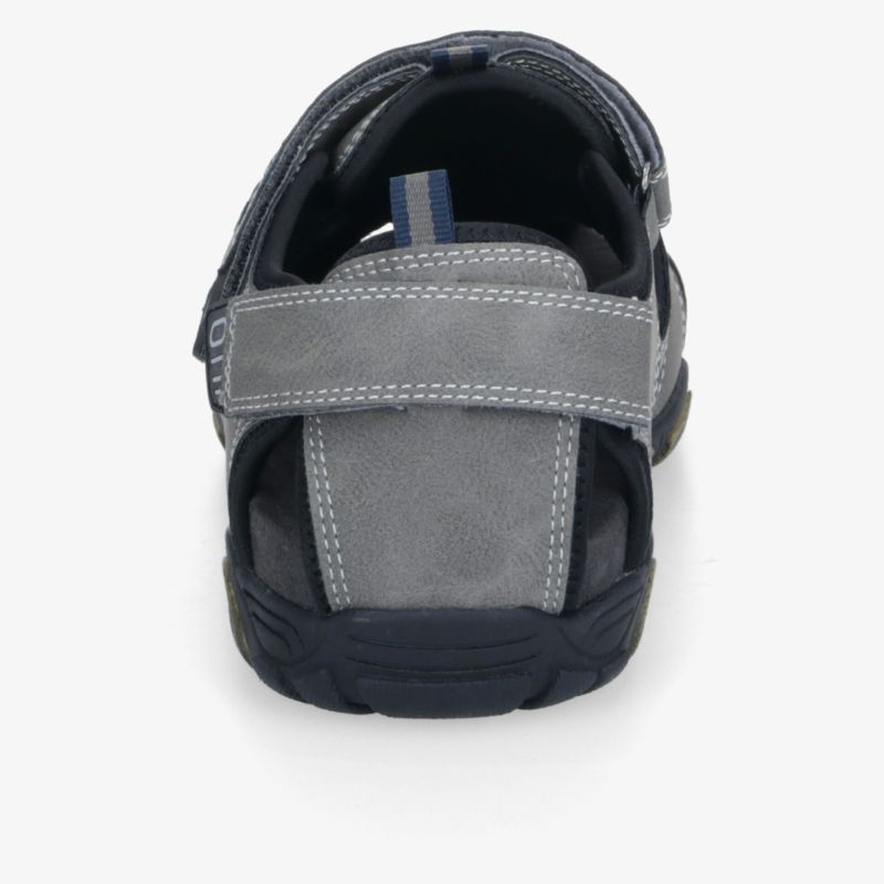 Zeitloser grauer Freizeitschuh mit Klettverschluss und rutschfester Sohle für optimalen Komfort.