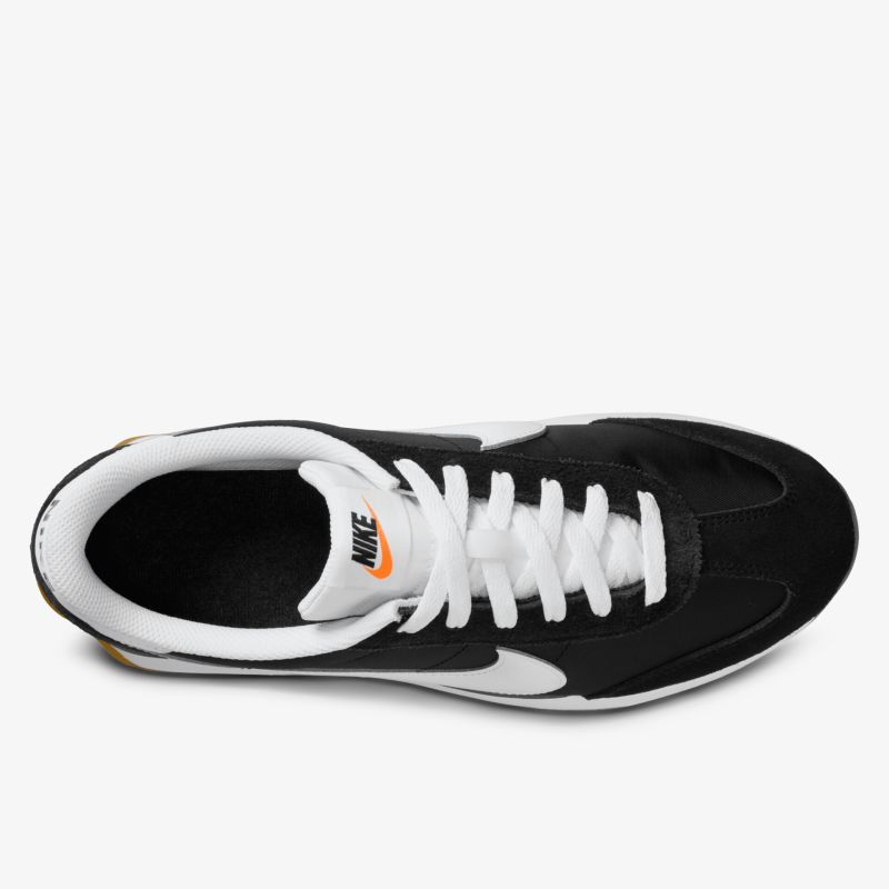 Schwarzer und weißer Sneaker mit Schnürung, ideal für Alltag und Freizeit