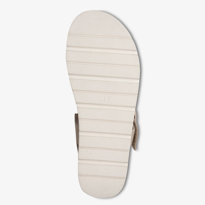 Weiße rutschfeste Schuhsohle mit flexiblen Profillinien für sicheren Halt und Tragekomfort