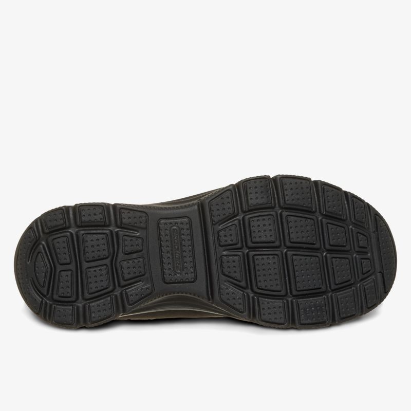 robuste schwarze Schuhsohle mit tiefem Profil für sicheren Halt und langlebige Nutzung