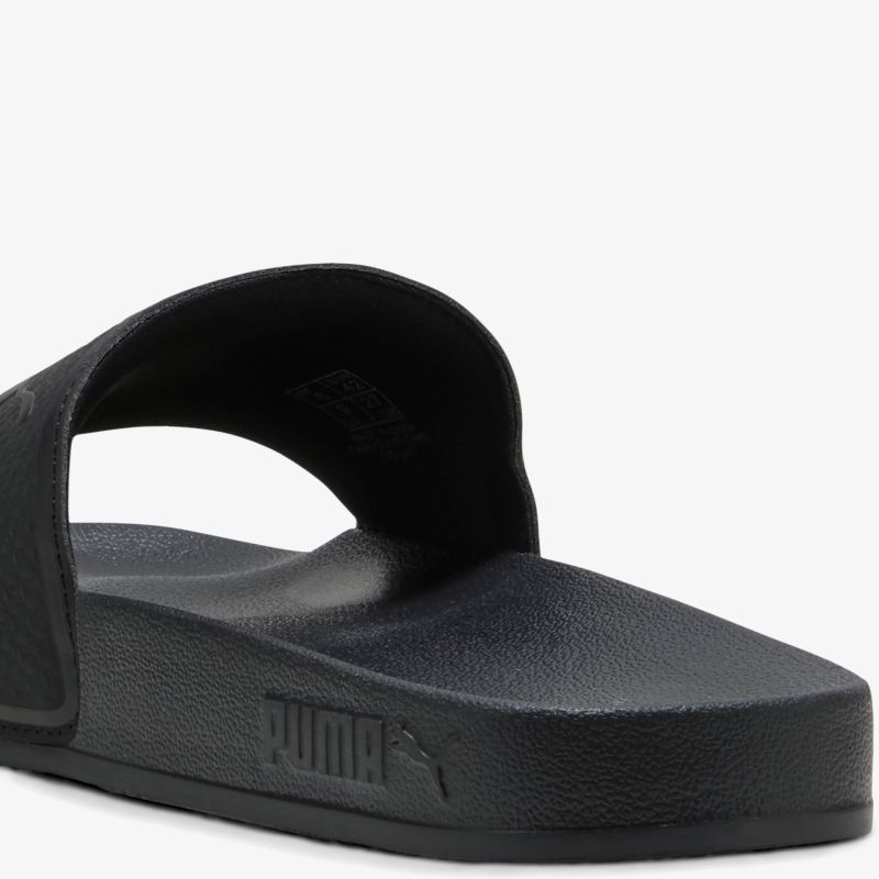 Schwarze Puma Slide mit weicher, gepolsterter Oberfläche für hohen Tragekomfort und sportlichen Look