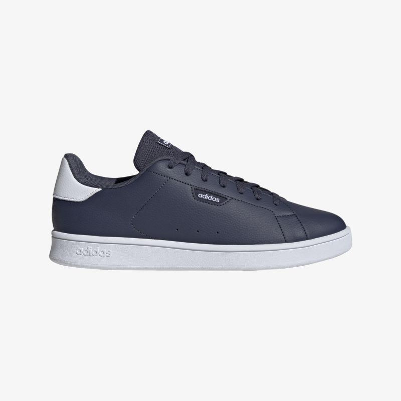 Stilvoller dunkelblauer Sneaker mit weißer Sohle, ideal für Freizeit und aktive Tage.