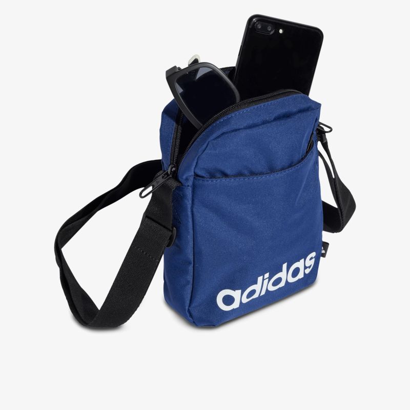 Kompakte blaue Adidas Schultertasche mit Reißverschluss und verstellbarem Gurt für bequemen Transport