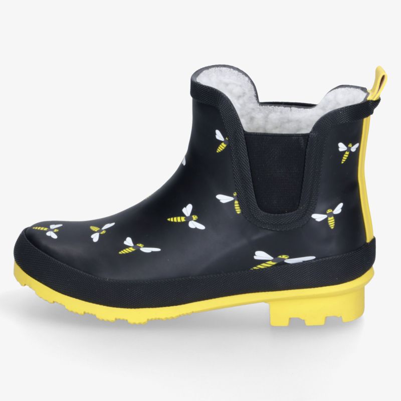 Stilvolle schwarze Gummistiefel mit Bienenmuster und gelber Sohle, ideal für nasses Wetter und Gartenarbeiten.
