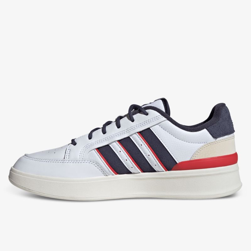 Seitliche Ansicht eines weißen Sneakers mit roten und schwarzen Details und bequemer Sohle