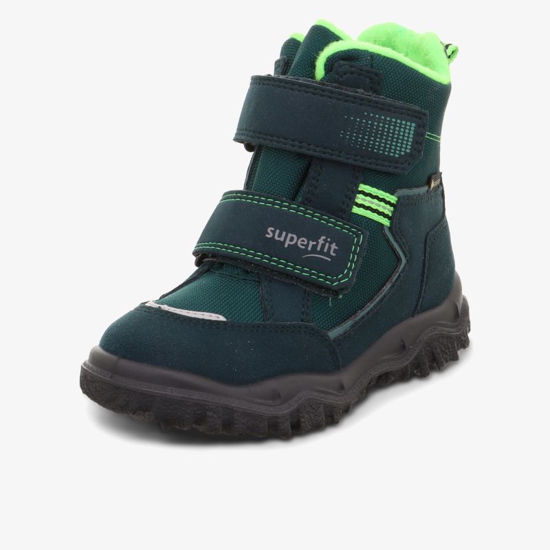 Robuster Schuh mit wasserdichtem Material, warmem Innenfutter und verstellbaren Klettverschlüssen für sicheren Halt