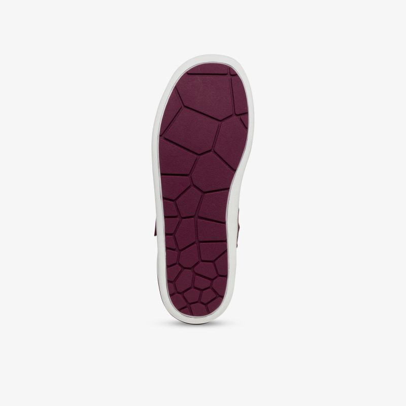 Lila Schuhsohle mit einzigartigem Muster, bietet hervorragende Traktion und stilvolles Design.