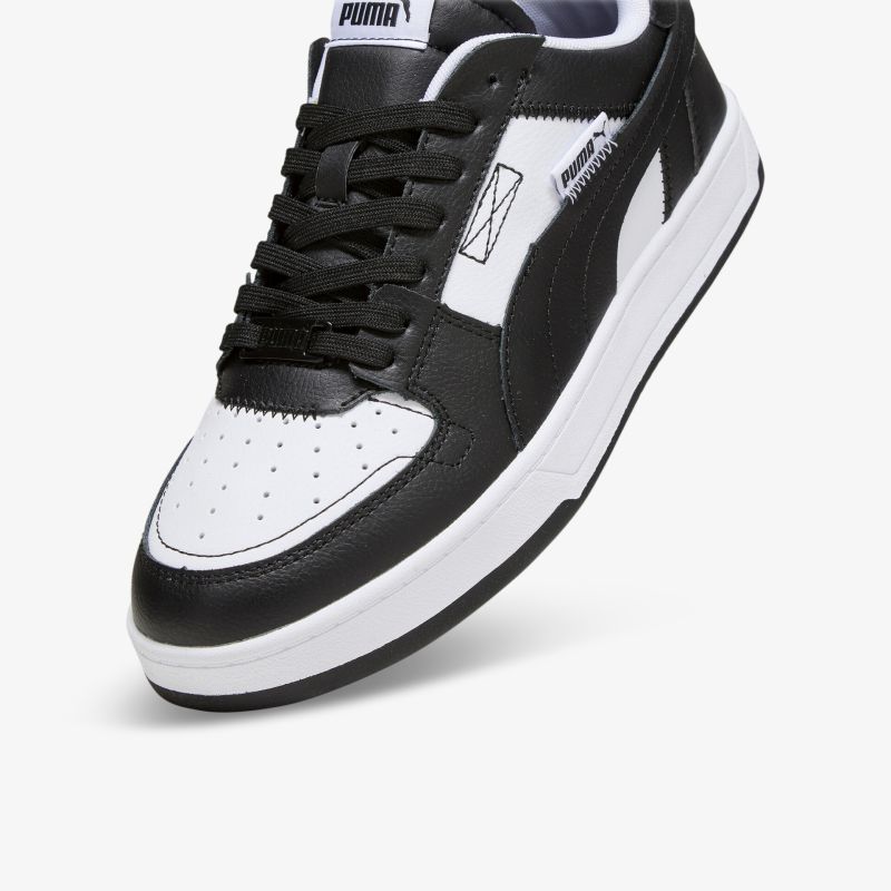 Sportlicher schwarz-weißer Sneaker aus Leder mit stabiler Sohle und bequemer Passform