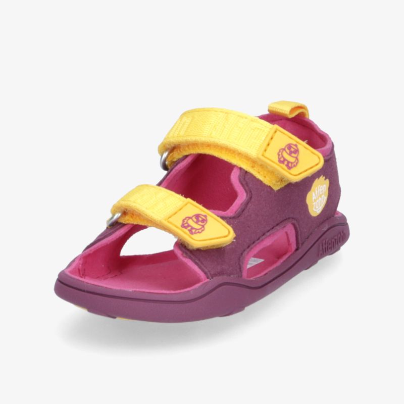 Bunte Sandale mit verstellbaren Riemen und rutschfester Sohle in Pink und Gelb. Ideal für bequemen Tragekomfort.