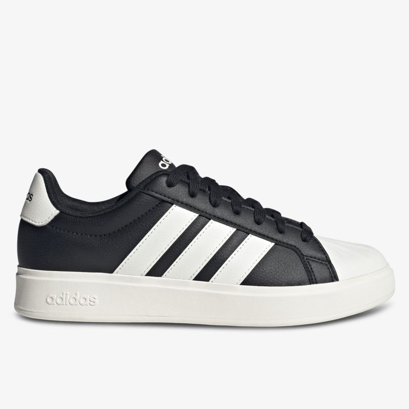 schwarzer Sneaker mit weißen Streifen und robuster weißer Sohle seitliche Ansicht