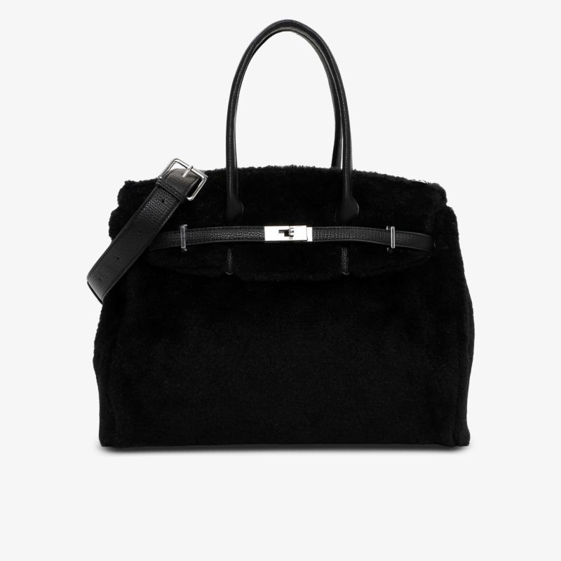 Elegante schwarze Handtasche mit weichem Fell, robusten Henkeln und großem Fassungsvermögen