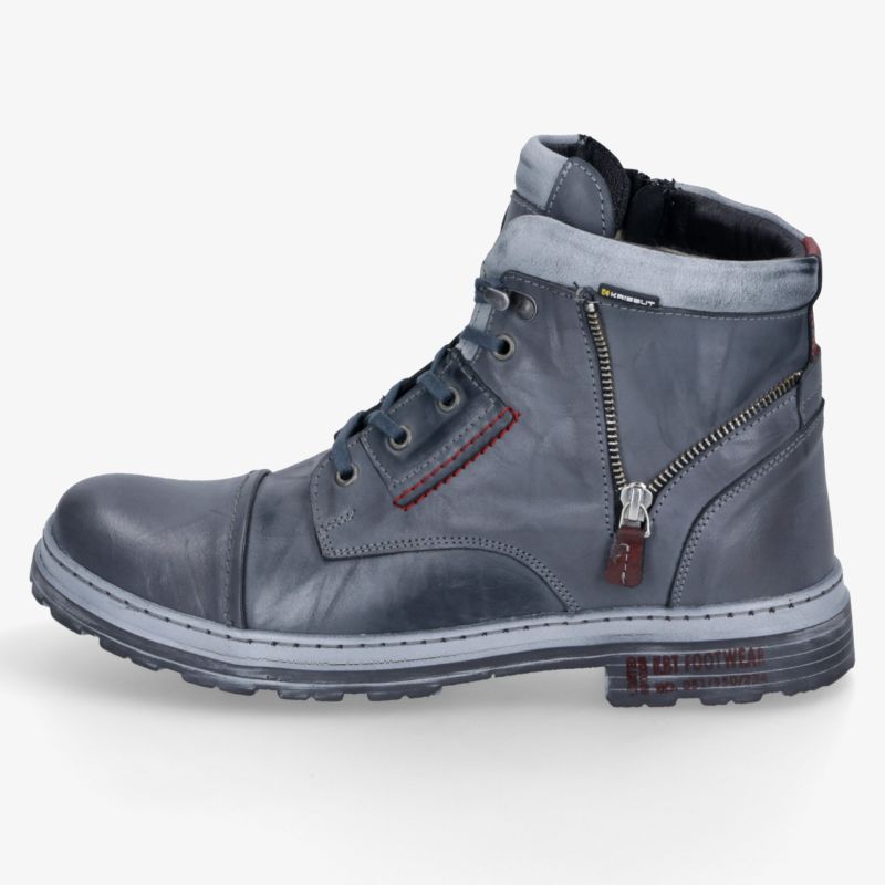 Blauer Boots mit Reißverschluss, Schnürung, robuster Profilsohle und weicher Polsterung in seitlicher Ansicht.