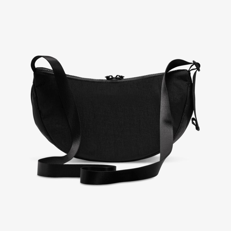 Schwarze kompakte Umhängetasche mit verstellbarem Riemen und sicherem Reißverschluss, modernes und elegantes Design