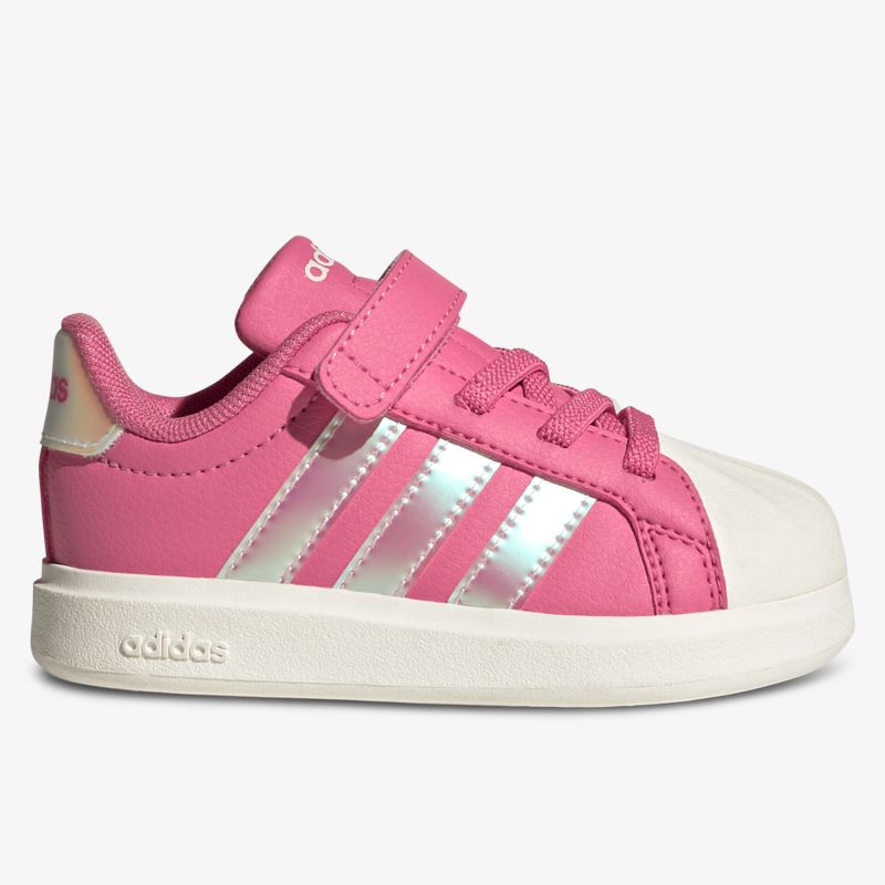 Seitliche Ansicht eines pink-weißen Sportschuhs mit robustem Design und bequemem Sitz