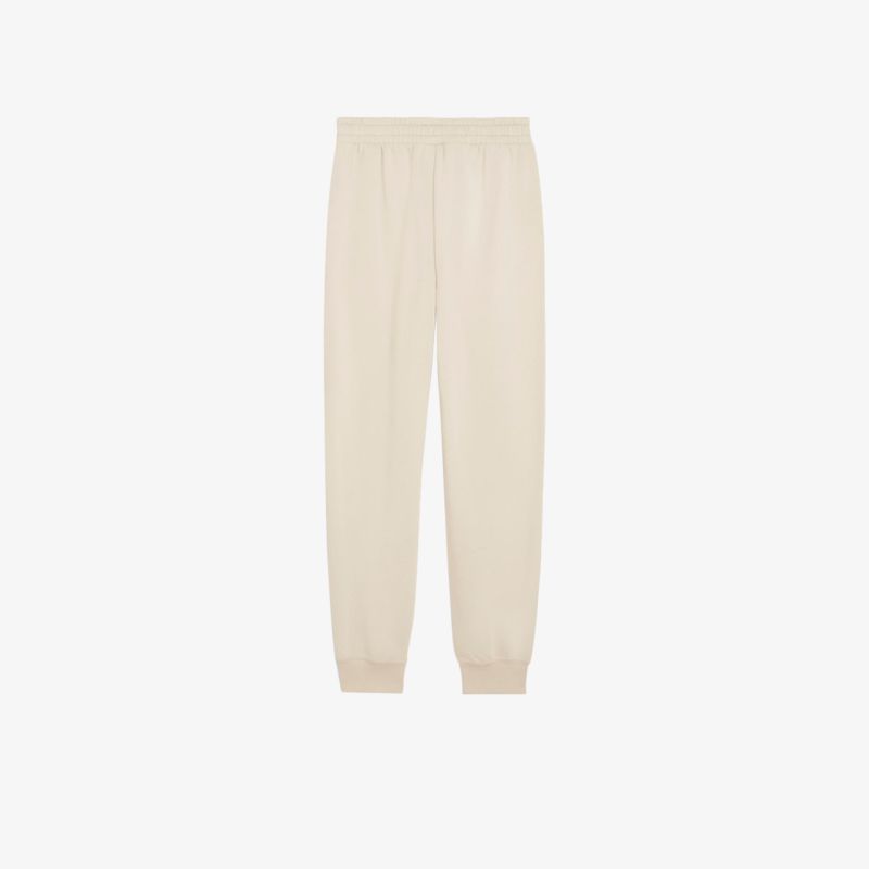 Bequeme Jogginghose mit elastischem Bund und lässigem Schnitt in weicher cremefarbener Stoffqualität.