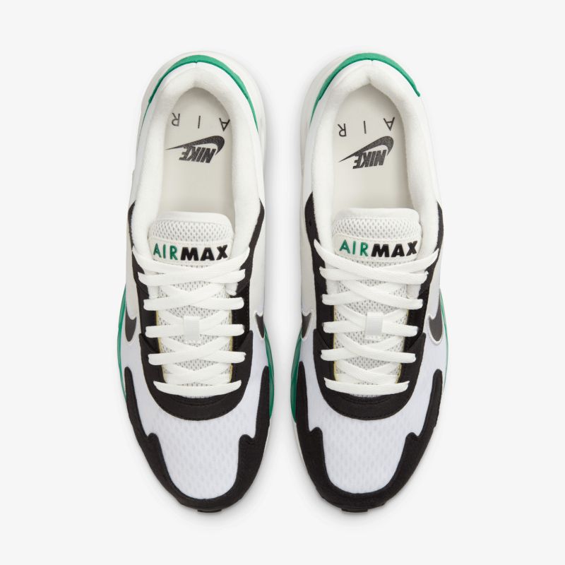 Weiß-schwarzes Nike Air Max Paar mit grünem Akzent, leichter atmungsaktiver Stoff und gepolsterte Innensohle