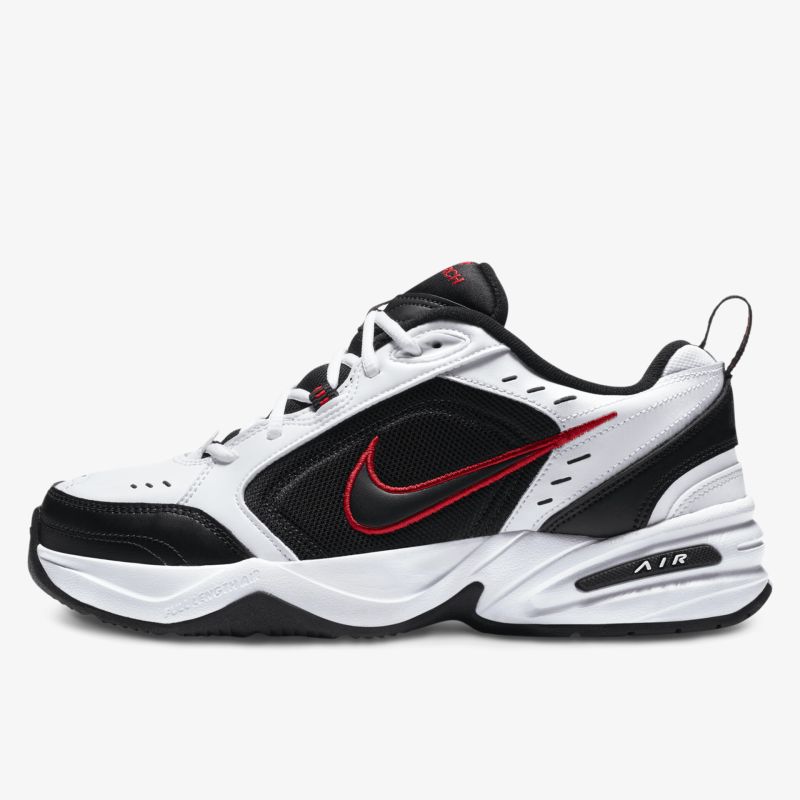 Moderner Sportschuh in Weiß-Schwarz mit rotem Akzent und bequemer Sohle.