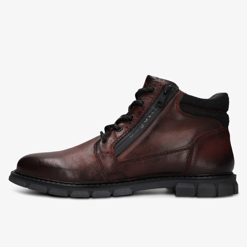 Eleganter Schuh aus hochwertigem Leder mit seitlichem Reißverschluss und stabiler Gummisohle für komfortablen Halt