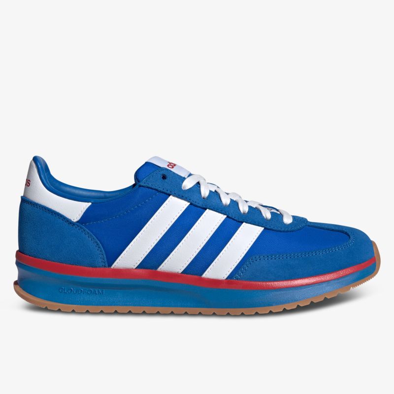 Seitliche Ansicht eines blauen Sneakers mit weißen Streifen, rotem Detail und rutschfester Gummisohle