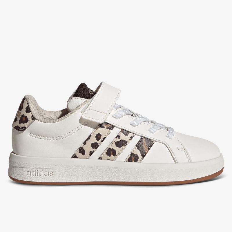 Moderner weißer Sneaker mit Leopardenmuster-Streifen und praktischem Klettverschluss, seitliche Ansicht