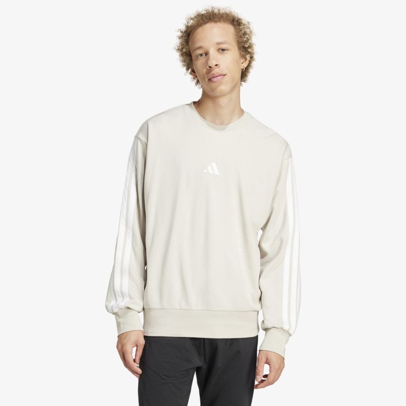 Beiges langärmliges Sweatshirt mit kleinem Logo, bequem und sportlich beim Tragen, legerer Stil