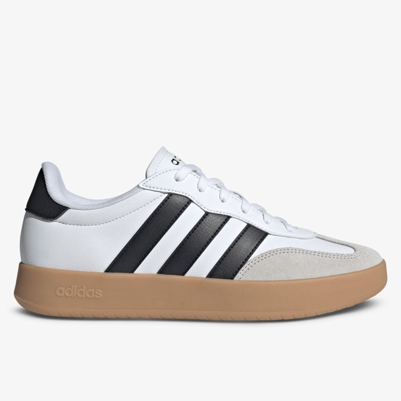 Seitliche Ansicht eines weißen Sneakers mit schwarzen Streifen und komfortabler Gummisohle in modernem Design