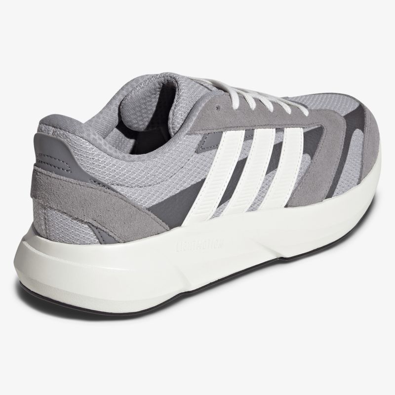 Sportlicher grauer Sneaker mit weißer Schnürung und bequemer Polsterung für komfortables Tragen