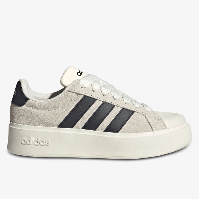 Moderner weißer Sneaker mit schwarzem Streifendetail und bequemer Sohle seitlich aufgenommen