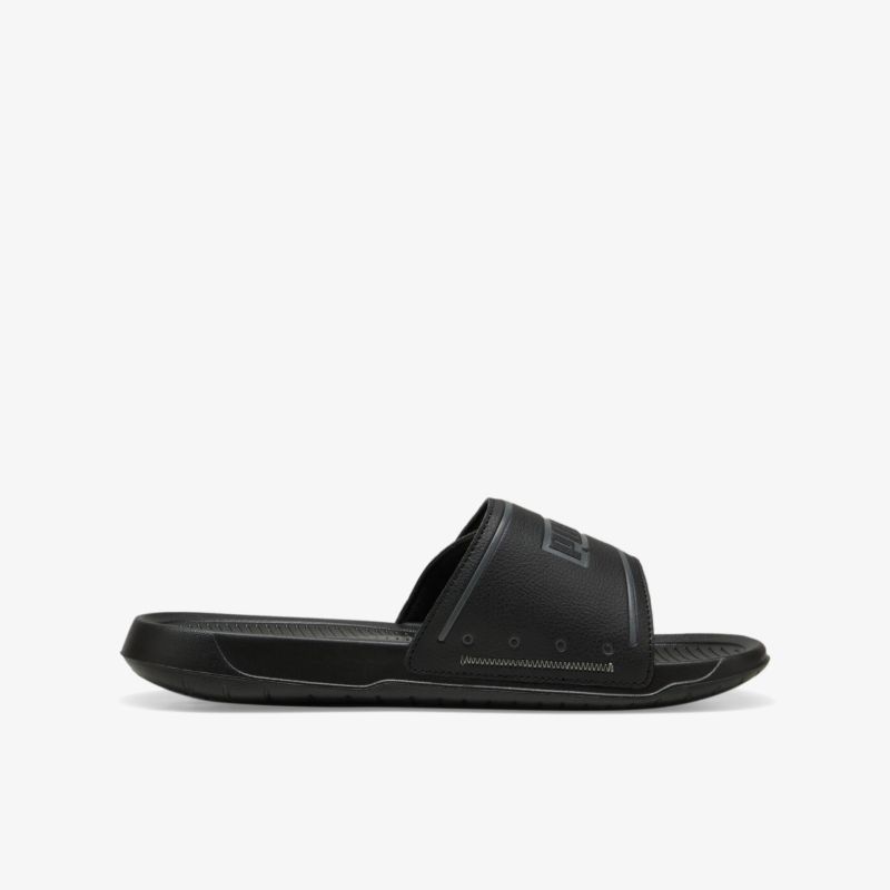 Schwarze Slide Sandale mit gepolsterter Sohle für hohen Komfort und rutschfeste Lauffläche, seitliche Ansicht