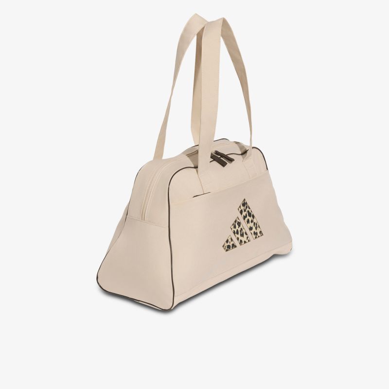 Beige Tasche mit Schultergurt und Reißverschluss, auffälligem geometrischem Muster, kompakt und stylisch