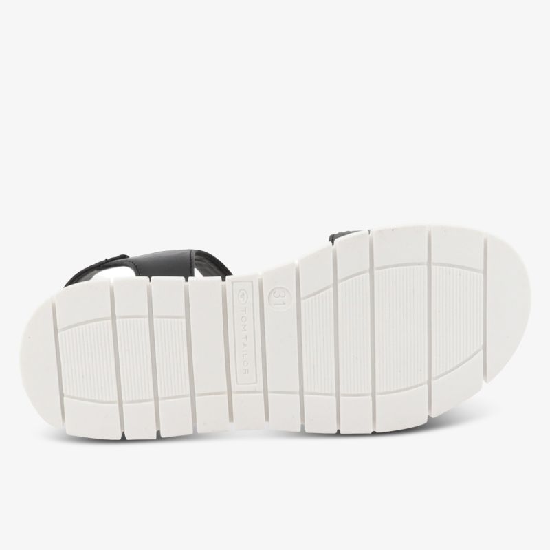 Flexible white sole of sandal with grip pattern, designed for comfort and casual wear