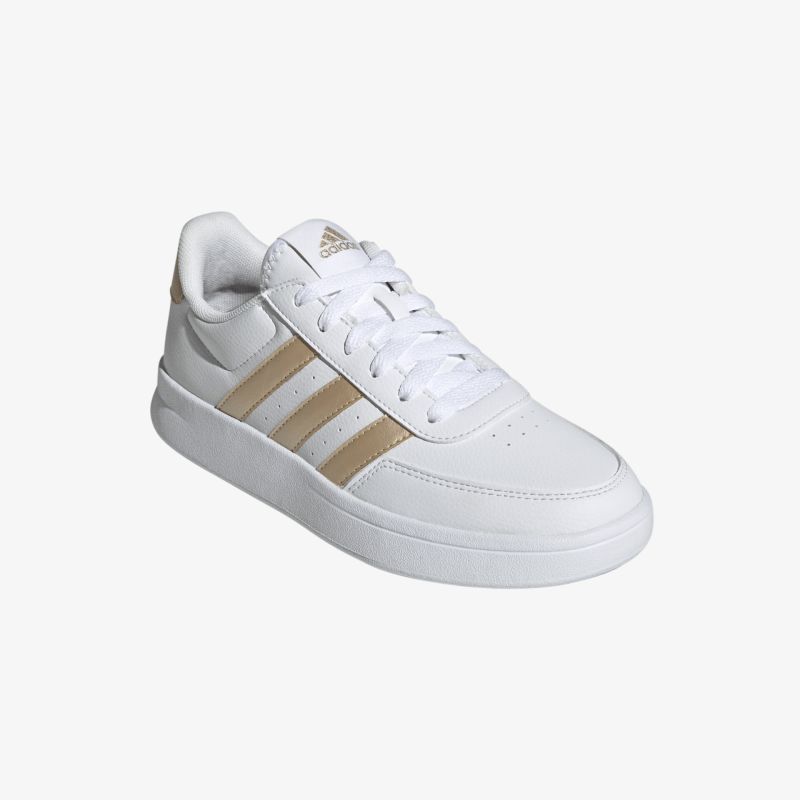 Weißer Sneaker mit goldenen Streifen und bequemer Passform für vielseitigen, stilvollen Komfort und rutschfeste Sohle.