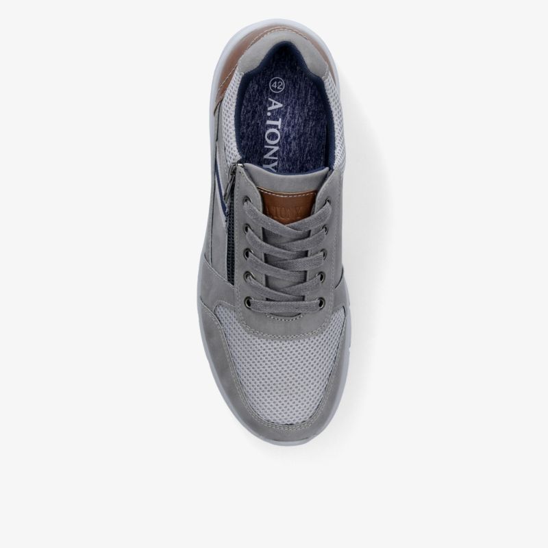 Moderner grauer Sneaker aus hochwertigen Materialien mit stilvollem Design und hohem Tragekomfort.