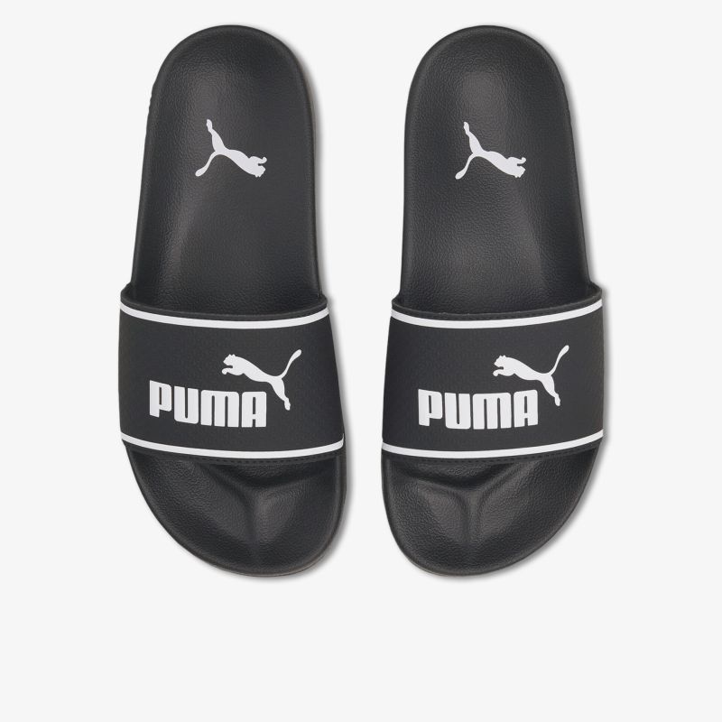 Schwarze Puma Badeschuhe mit weißem Logo, bequem und rutschfest, ideal für Freizeit und Bad