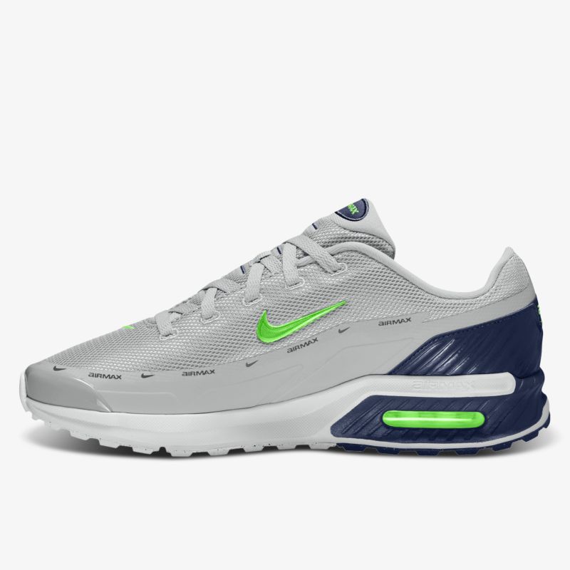 Moderner grauer Sneaker mit grünen Details und komfortabler Sohle.