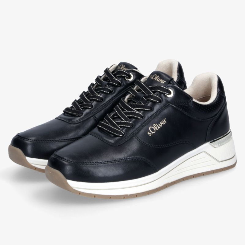 Sportliche schwarze Schuhe mit weißer Sohle, bequem gepolstert und robust für den Alltag