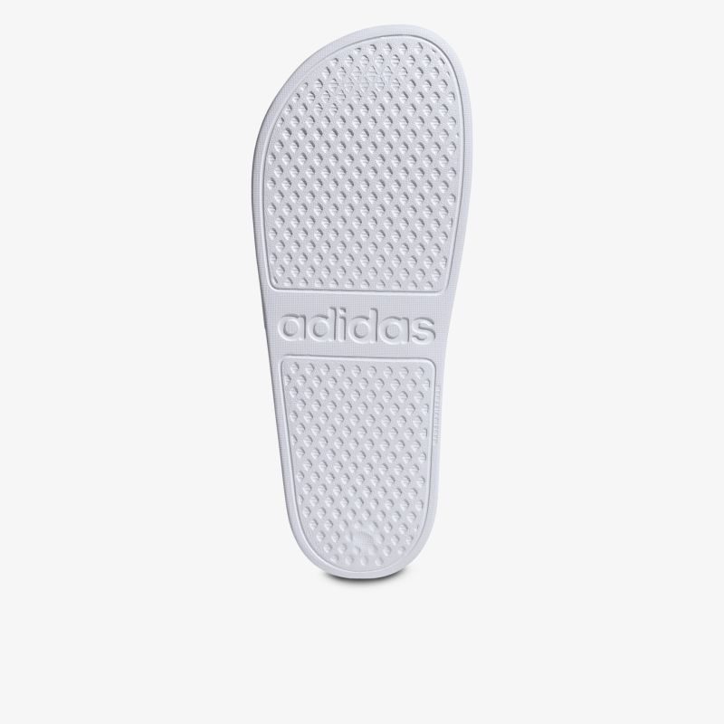 Weiße rutschfeste Sohle eines Schuhs mit Adidas-Logo für optimalen Grip und Komfort