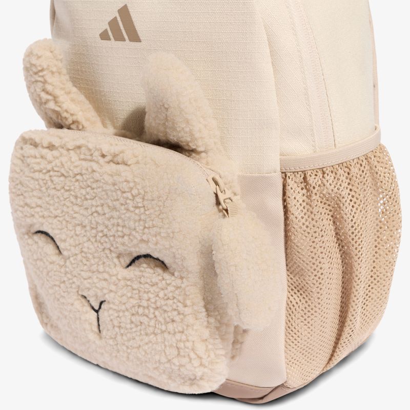 Detailansicht einer flauschigen Beuteltasche mit Reißverschluss und niedlichem Gesicht, weiches Material
