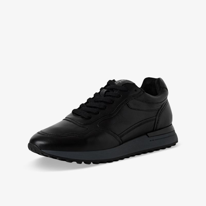 Schwarzer Sneaker seitlich, sportlich und bequem mit robustem Material und rutschfester Profilsohle