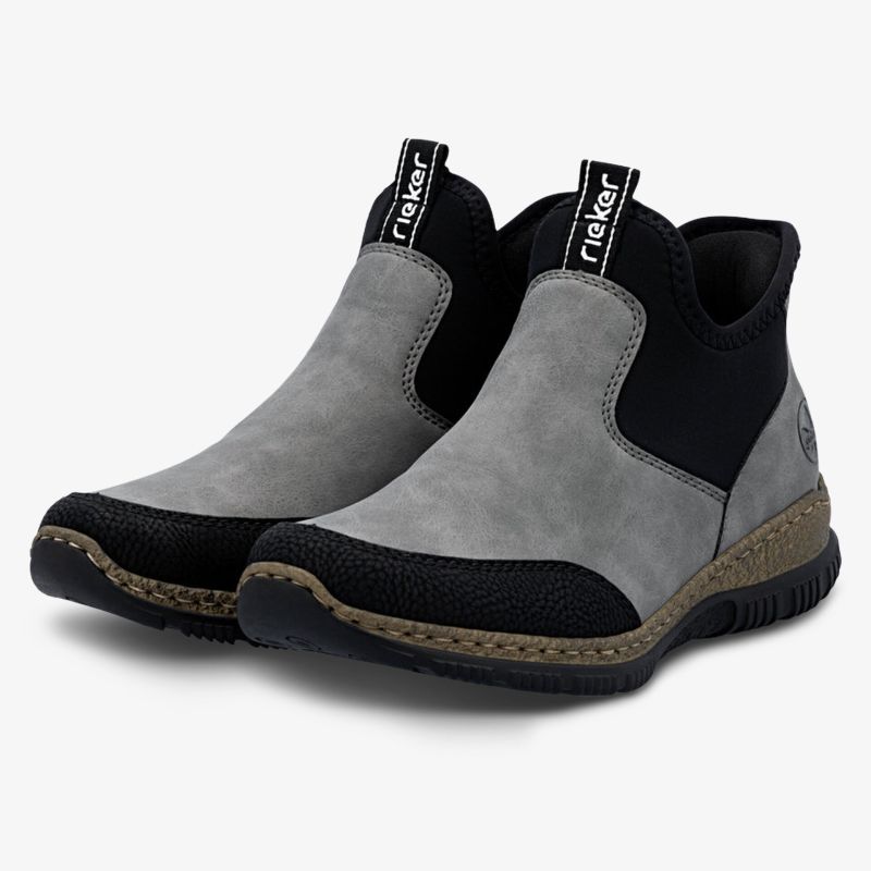Bequeme graue und schwarze Schuhe mit elastischen Seiteneinsätzen und rutschfester Sohle