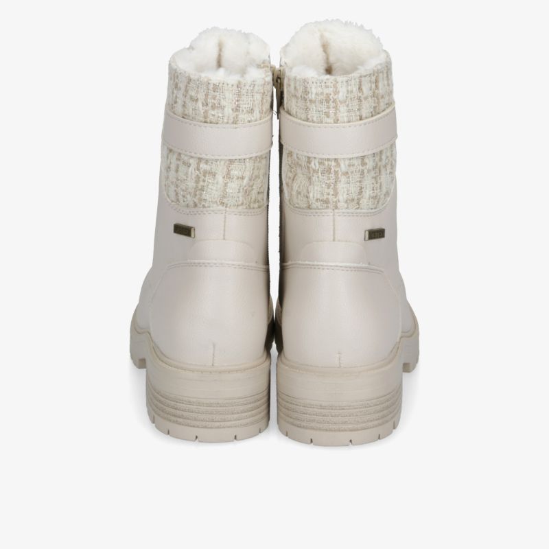 Beige Stiefel mit weichem Innenfutter und gerippter Außenseite für maximalen Komfort und Stil.