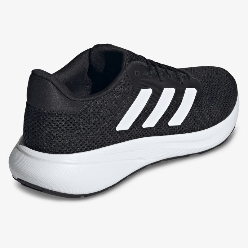 Schwarzer Sportschuh mit weißer Sohle, atmungsaktives Mesh-Material und bequemer Polstersohle