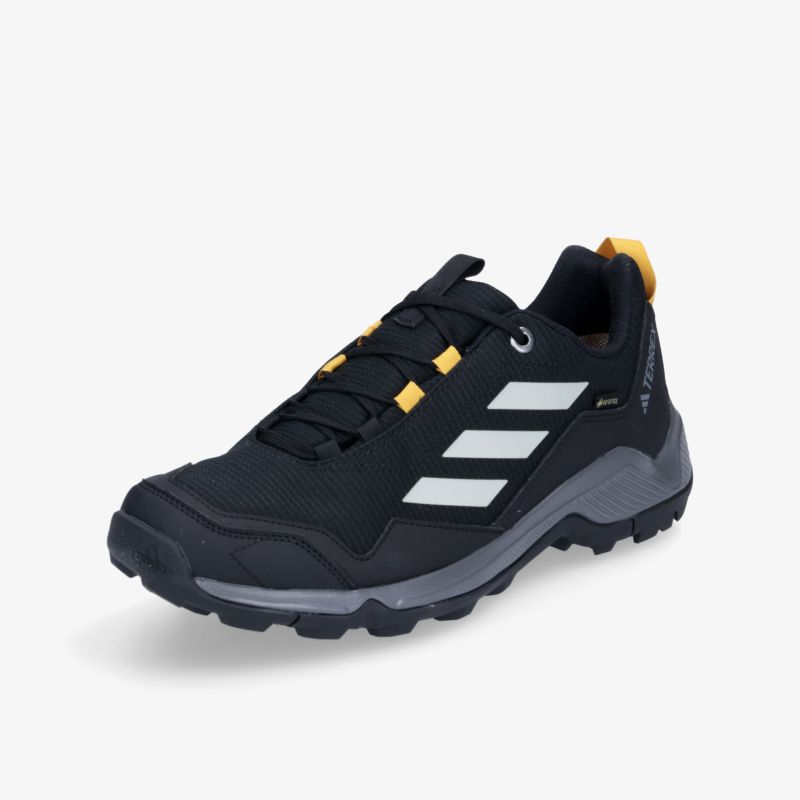Langlebiger schwarzer Outdoor-Schuh mit gelben Akzenten und robuster Sohle für maximalen Komfort und Halt.