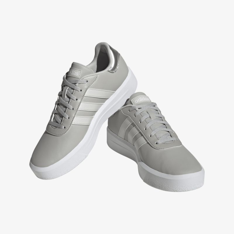 Stylische graue Sneakers mit weißem Rand und klassischer Schnürung für lässigen Alltagslook und hohen Komfort.