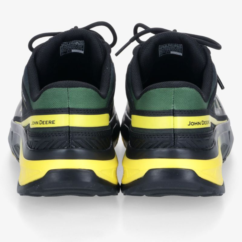 Robuster Sportschuh in Schwarz mit gelben und grünen Akzenten, stabile Rückansicht zeigt gepolsterten Komfort