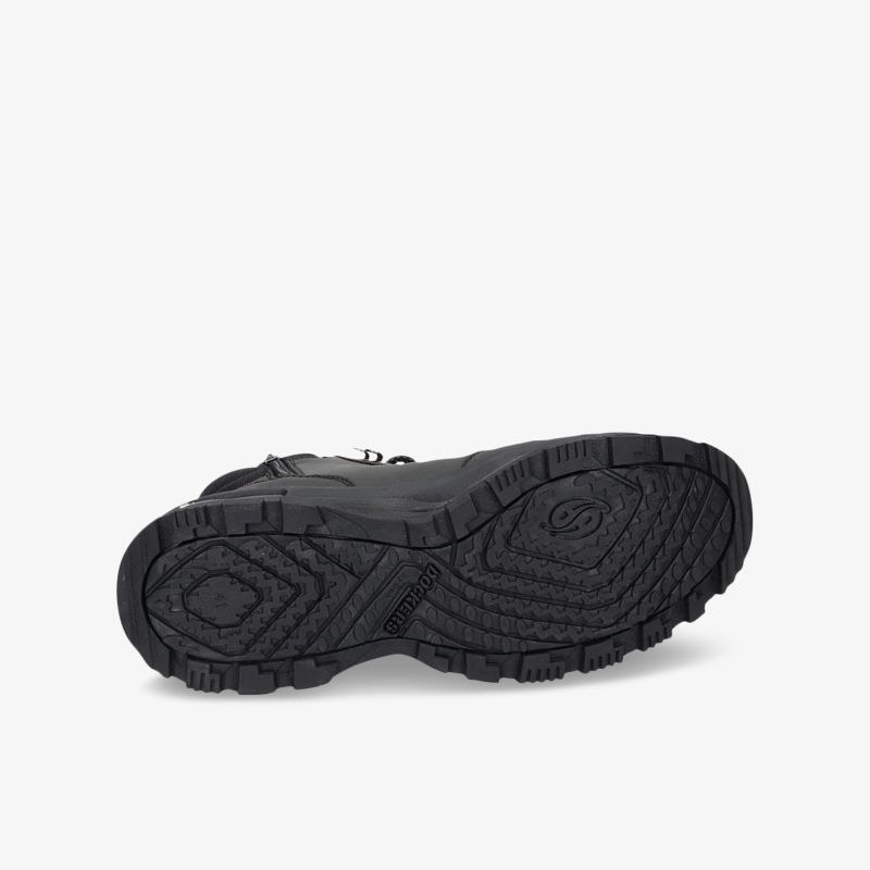 Robuste schwarze Schuhsohle mit tiefem Profil, ideal für sicheren Halt und langanhaltenden Tragekomfort