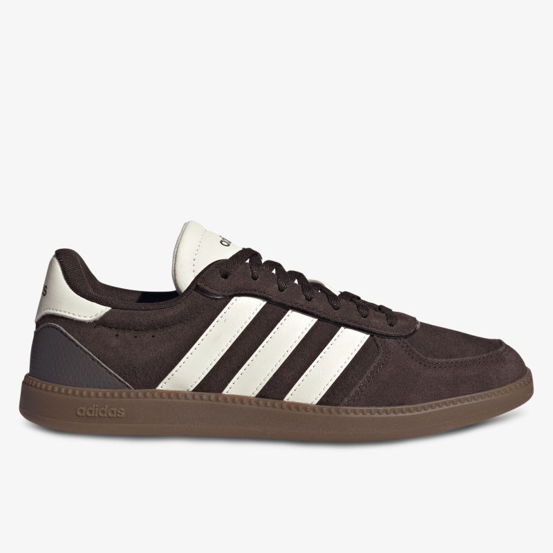 Seitliche Ansicht eines bequemen Sneakers mit weißen Streifen und rutschfester Sohle