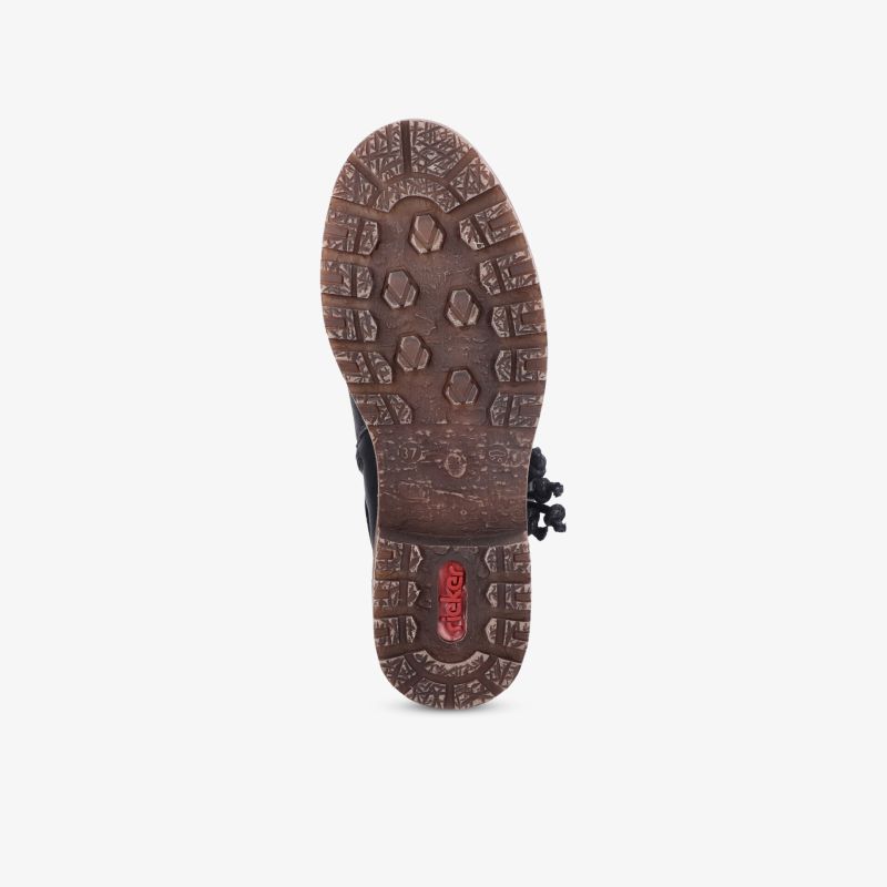 Robuste braune Schuhsohle mit tiefem Profil für optimale Rutschfestigkeit und strapazierfähigen Halt auf unterschiedlichen Untergründen