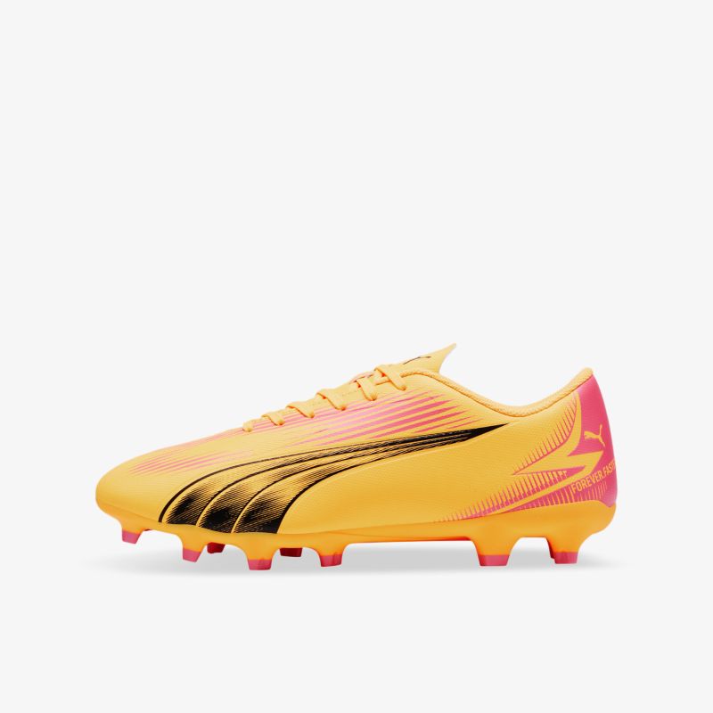 Leichter Fußballschuh in gelb und pink mit robusten Nocken für sicheren Halt auf dem Spielfeld